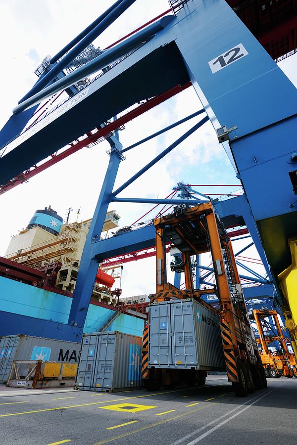 Container Crane Hoisting Cargo Onto Ship Photograph by Christian Lagerek/science Photo Library