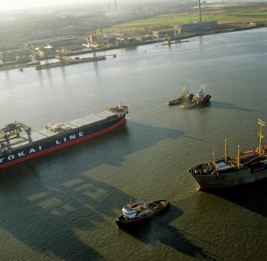 Container Ship Being Towed By Tug Boats Photograph by Skyscan/science Photo Library