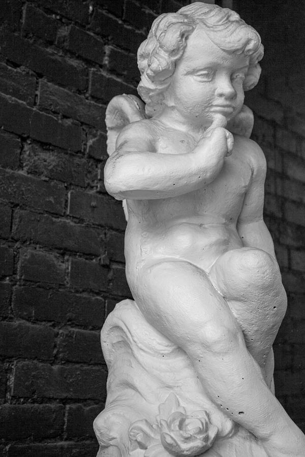 Contemplating Cherub Photograph by Eugene Campbell
