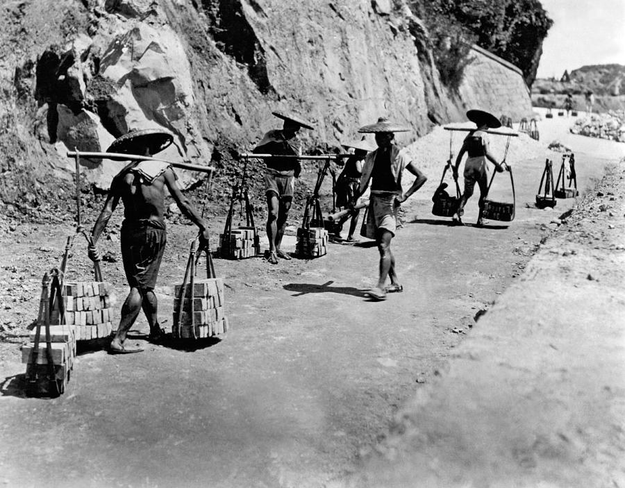 Hong Kong Photograph - Coolies Carrying Bricks by Underwood Archives