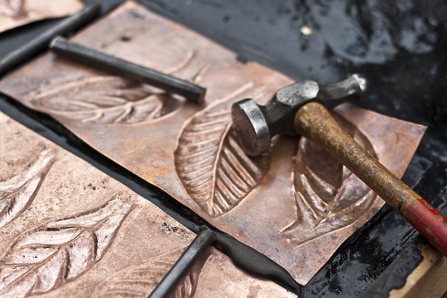 Coppersmith tools and copper sheets with leaves Photograph by Linda Mc Nulty Photography (www.lindamcnulty.ie)