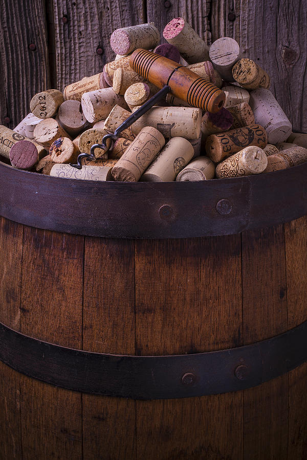 Cork Photograph - Corkscrew And Corks On Wine Barrel by Garry Gay