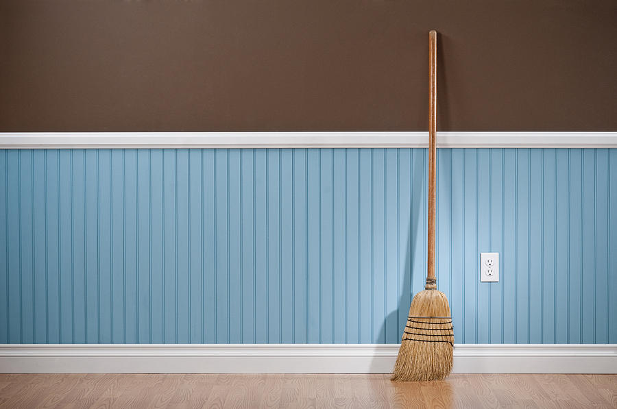 Corn whisk broom standing in empty room Photograph by Spiderstock