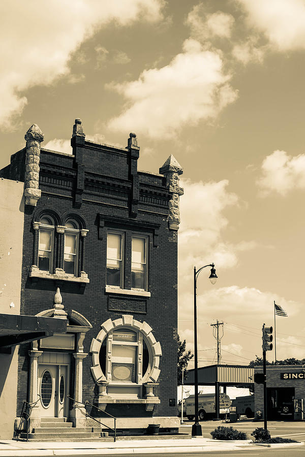 Black And White Photograph - Corner Building in Perry by Hillis Creative