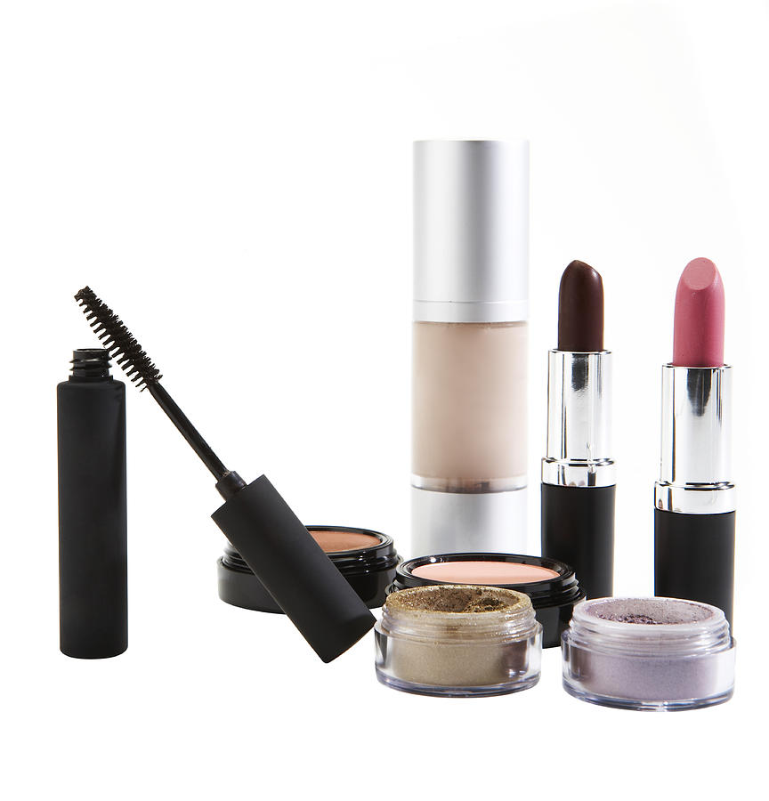 Cosmetics on white background Photograph by Thomas Northcut