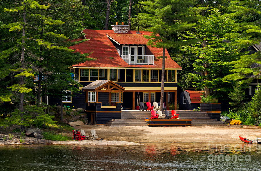 Cottage on a lake Photograph by Les Palenik