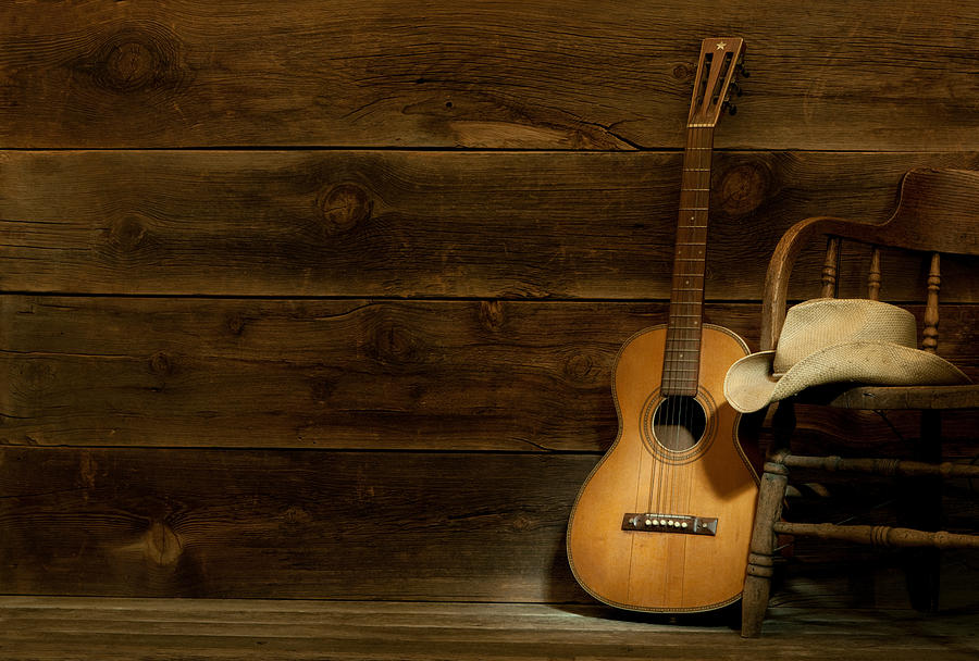 Country and Western Music scene w/chair,hat,guitar-barnwood background Photograph by GaryAlvis