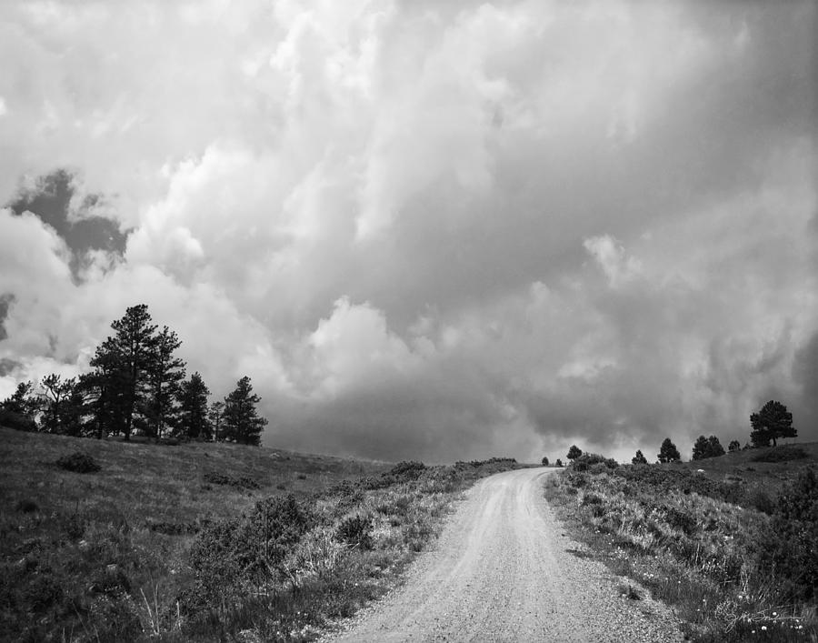 Black And White Photograph - Country Road with Stormy Sky in Black and White by Julie Magers Soulen