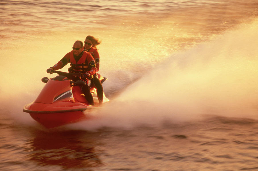 Couple Enjoying A Ride On Their Jet Ski Photograph by Joel Sheagren Couple Enjoying A Ride On Their Jet Ski Photograph by Joel Sheagren