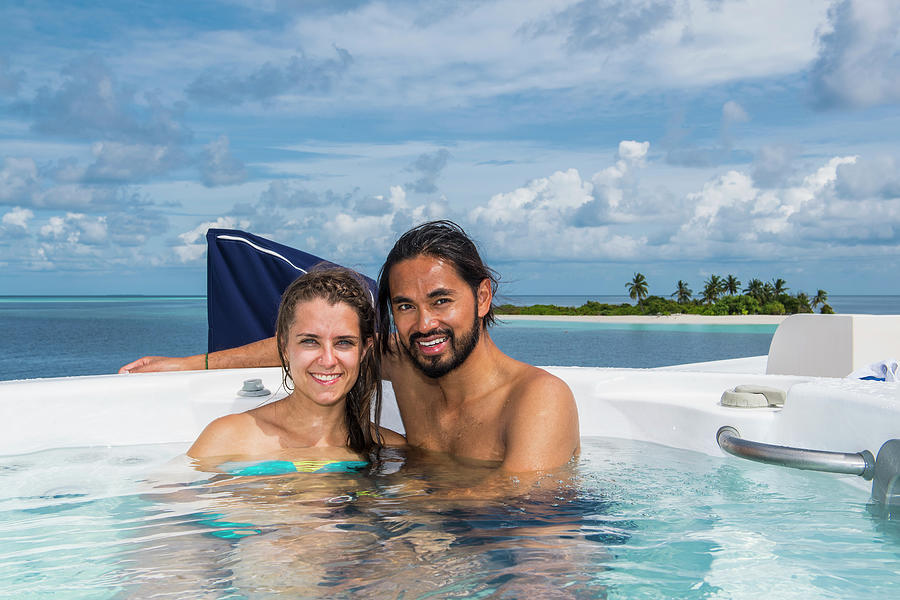 Couple Enjoying Time In A Hot Tub Photograph By Henn Photography Fine