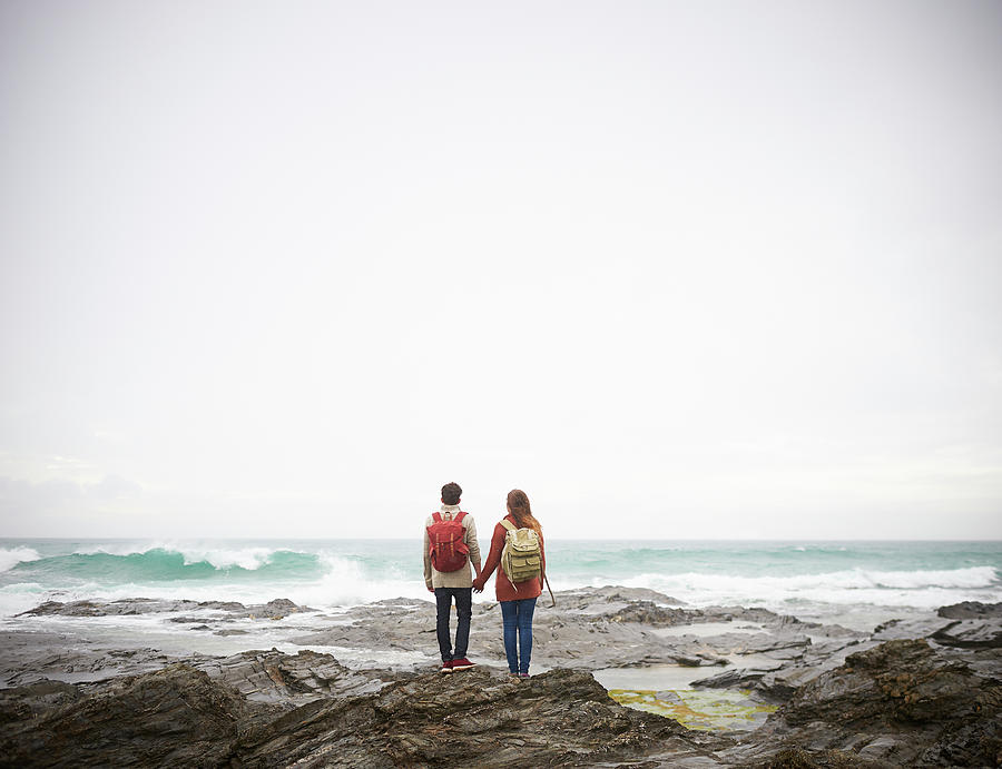 Couple Holding Hands And Looking Out To Photograph by Dougal Waters