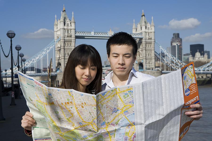 Couple in London with map Photograph by Image Source
