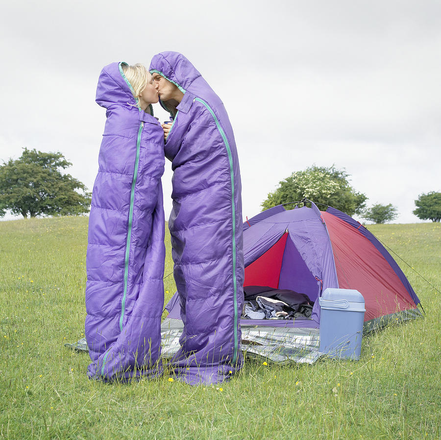 Couple in Sleeping Bags Kiss Photograph by Preston Forrest
