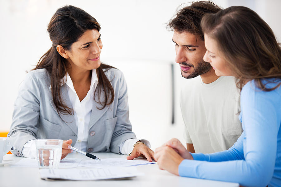 Couple meeting with financial advisor Photograph by Skynesher