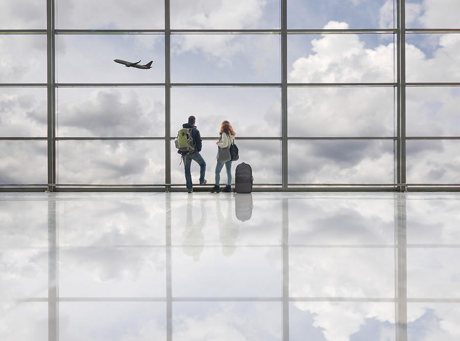 Couple on airport Photograph by Jasmin Merdan