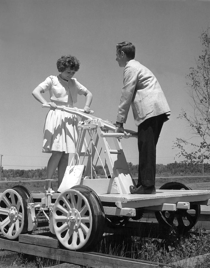 Couple Powers A Railroad Cart Photograph by Underwood Archives