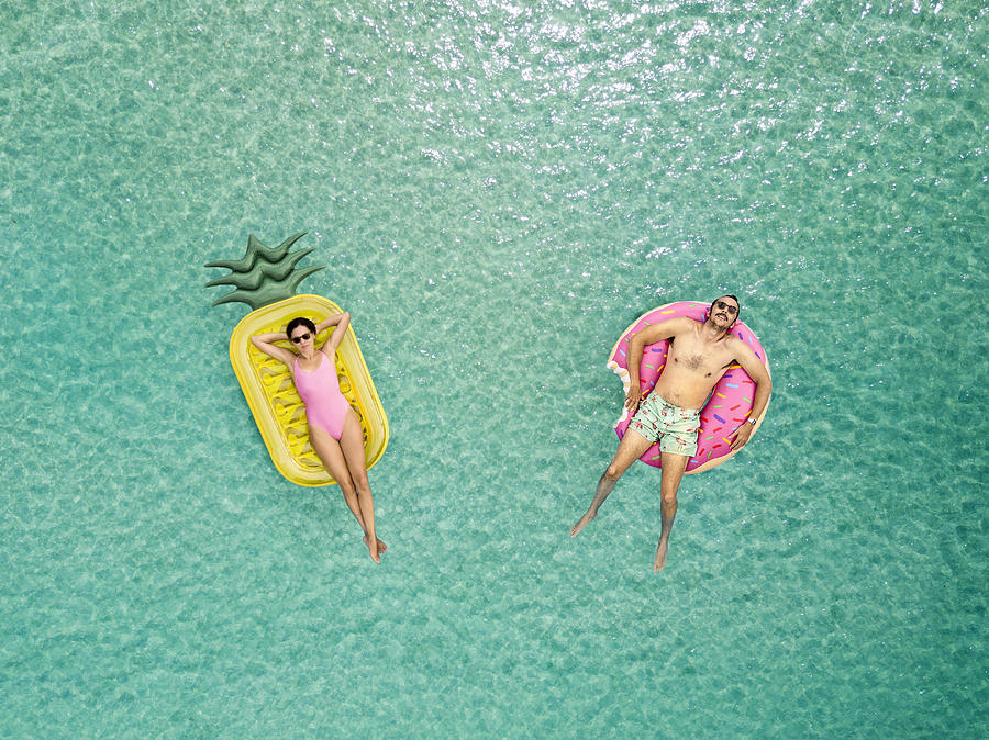 Couple relaxing at the sea Photograph by Orbon Alija