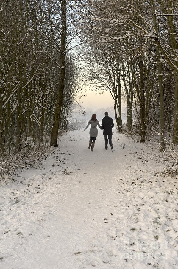 Winter Photograph - Couple Walking In A Winter Wonderland by Lee Avison