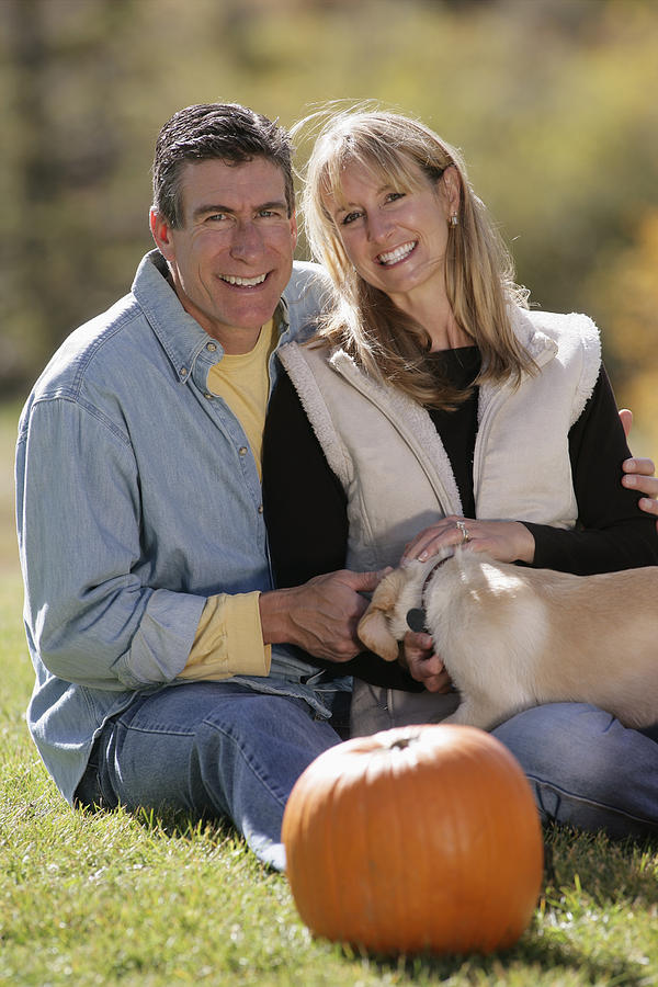 Couple with dog Photograph by Comstock Images