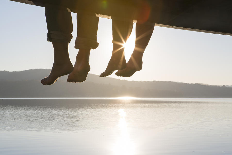 Couples Feet Dangle From Dock,above Tranquil Lake Photograph by Ascent Xmedia Couples Feet Dangle From Dock,above Tranquil Lake Photograph by Ascent Xmedia