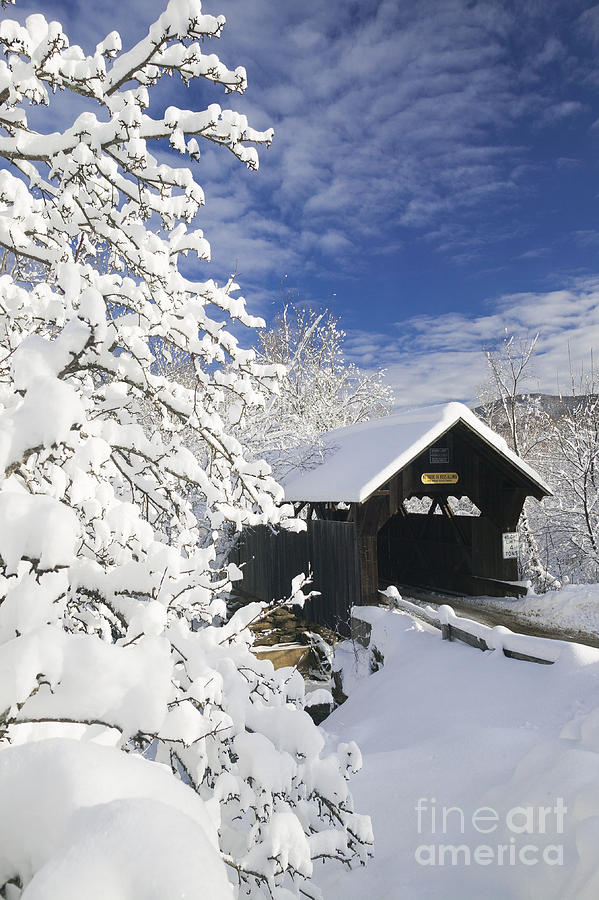 Covered bridged blanketed in fresh snow. Photograph by Don Landwehrle