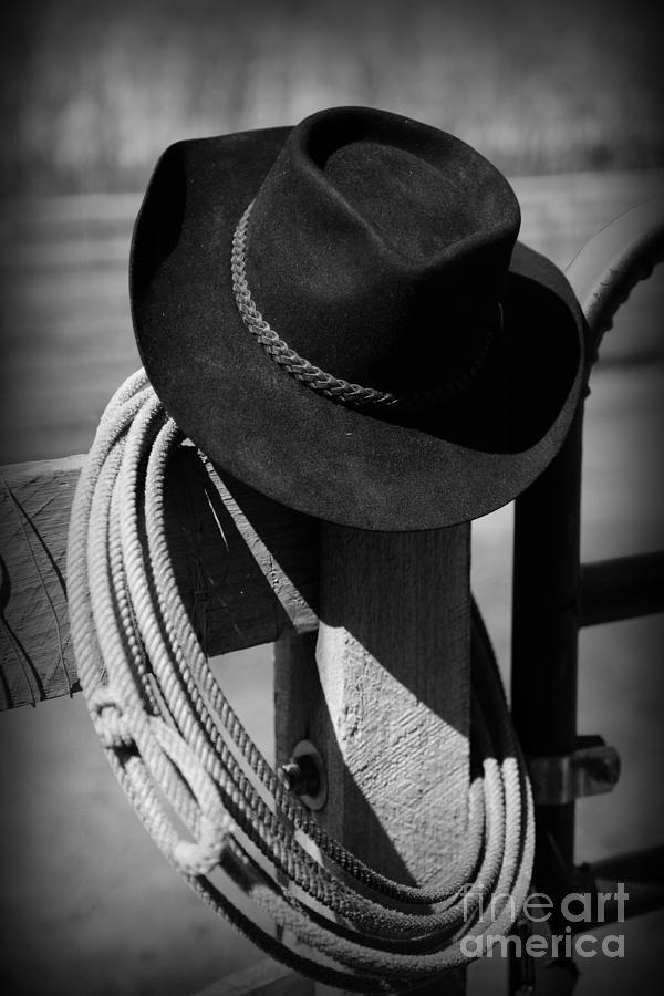 Black And White Photograph - Cowboy Hat on Fence Post in Black and White by Paul Ward