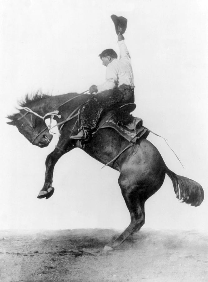 Cowboy Riding Bucking Bronco, 1911 Photograph by Science Source