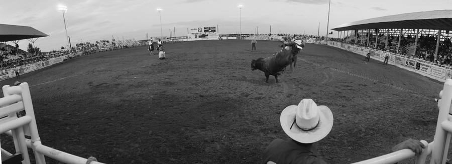Black And White Photograph - Cowboy Riding Bull At Rodeo Arena by Panoramic Images