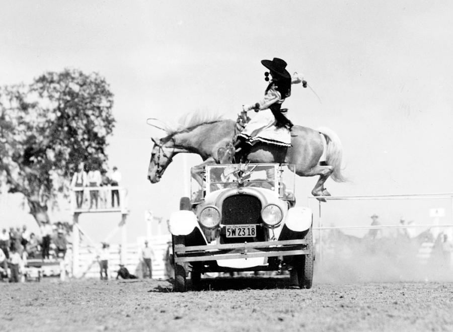 Cowgirl Performing Stunt, 1934 Photograph by Science Source