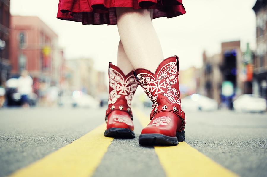 Cowgirl with Red Boots in the Road Photograph by Amesy