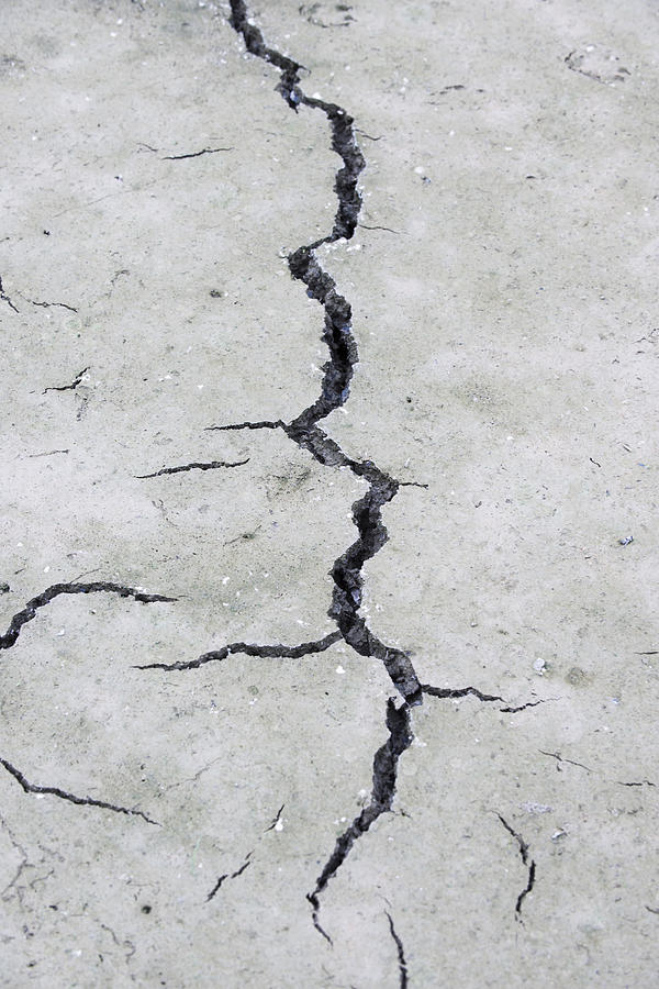 Cracked, dry earth Photograph by PhotoAlto/Odilon Dimier