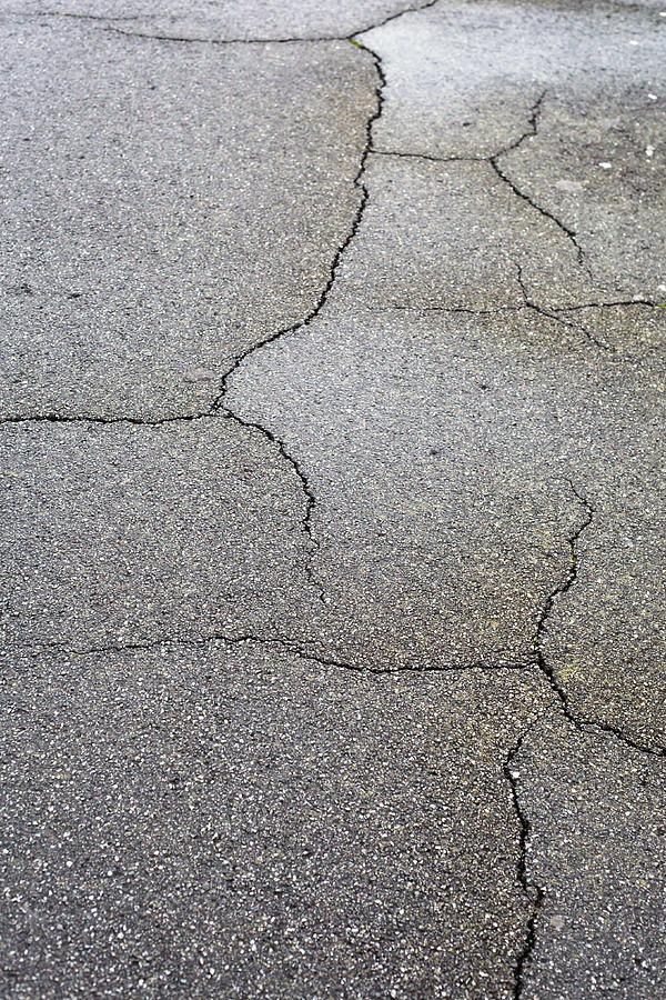 Abstract Photograph - Cracked tarmac by Tom Gowanlock