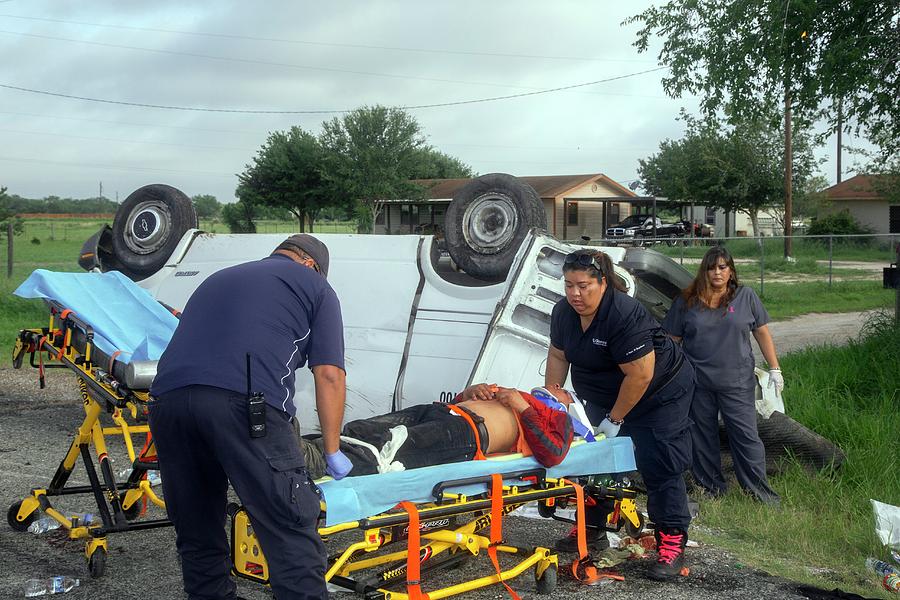 Crash Victim Being Treated Photograph by Jim West