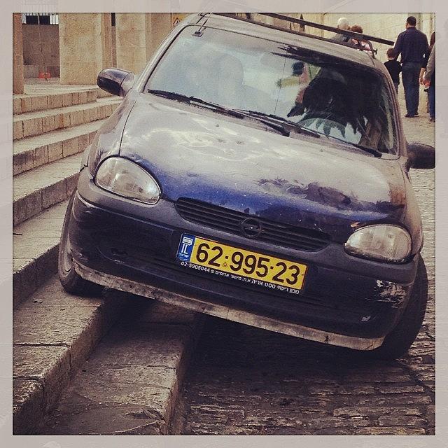 Creative Parking In Old Jerusalem Photograph by Pinkie Pictures