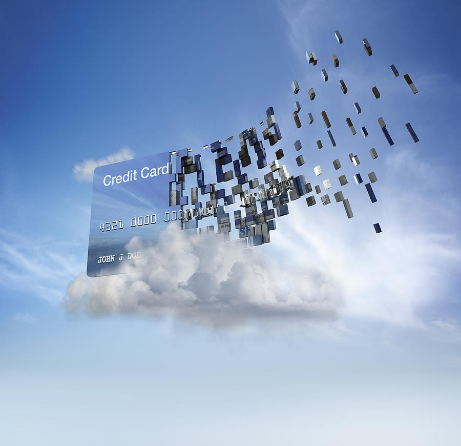 Credit card disintegrating into cloud in blue sky Photograph by Colin Anderson Productions Pty Ltd