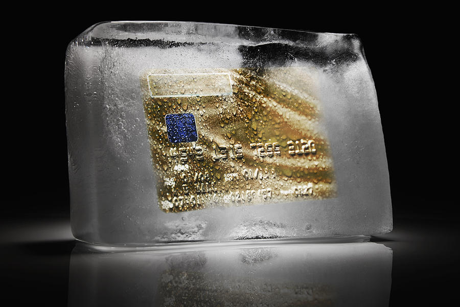 Credit card frozen inside a block of ice Photograph by Andrew Bret Wallis