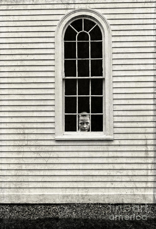 Creepy victorian girl looking out window Photograph by Edward Fielding