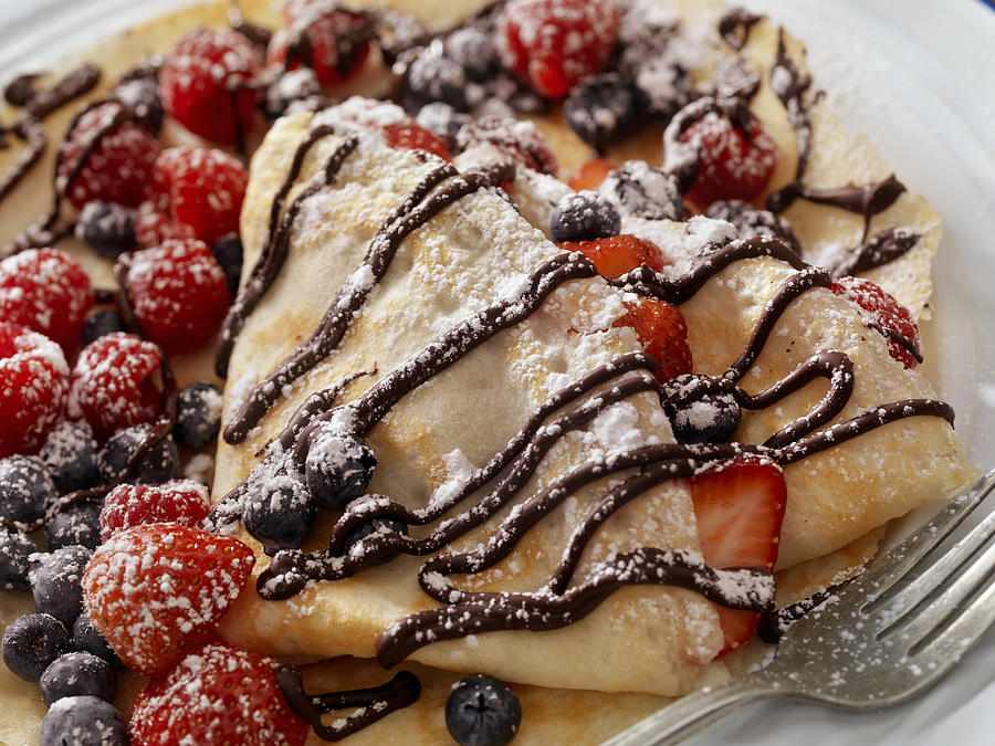 Crepes with Fresh Berries, Chocolate Sauce and Powdered sugar Photograph by Lauri Patterson