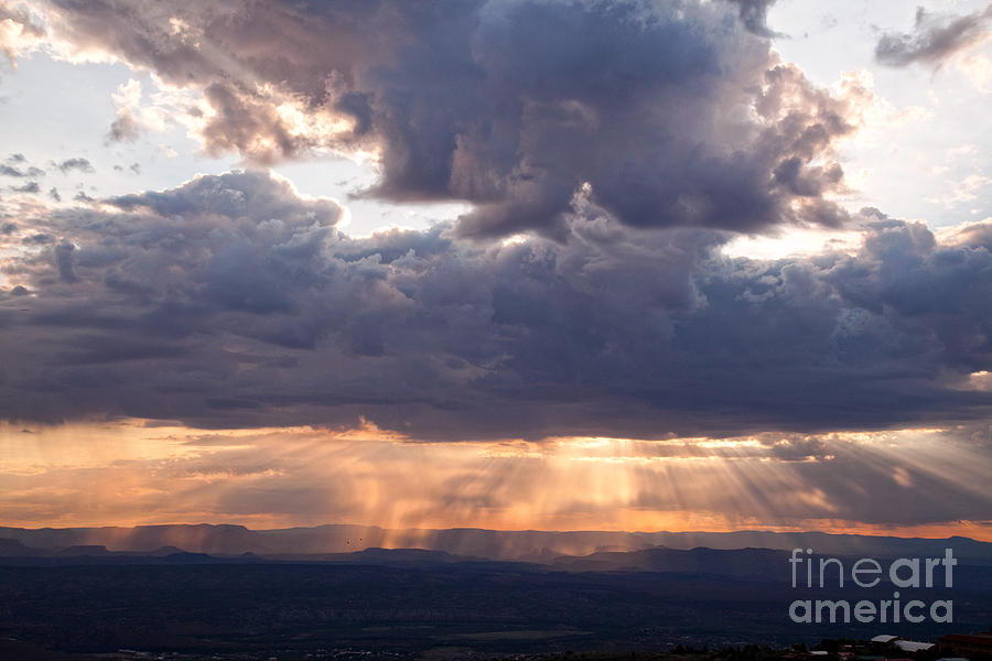 Crepuscular light rays over Sedona from Jerome Arizona Photograph by Ron Chilston