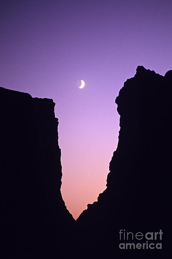 Crescent moon between rock formations Face Rock Photograph by Jim Corwin