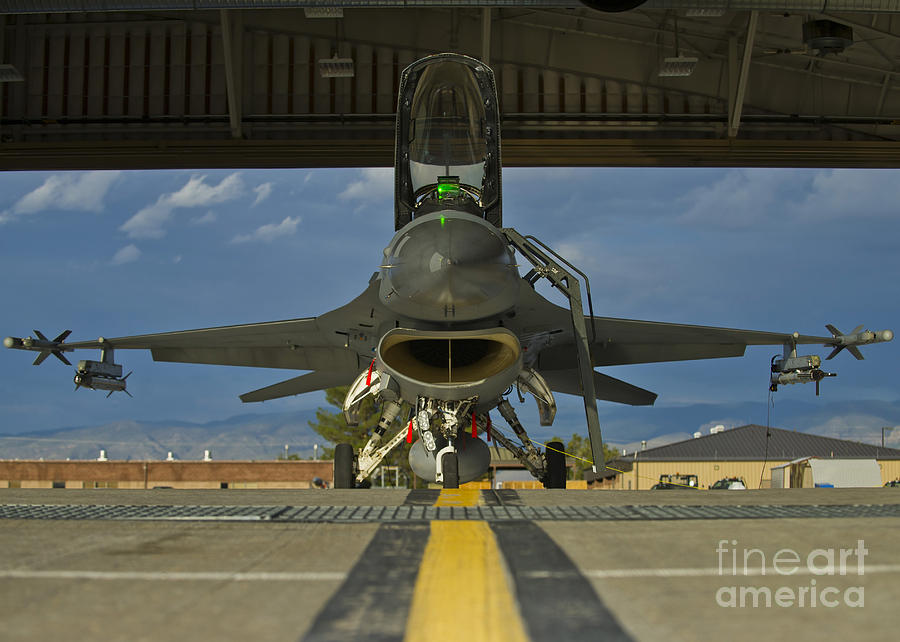 Crew Members Prepare An F-16 Fighting Photograph