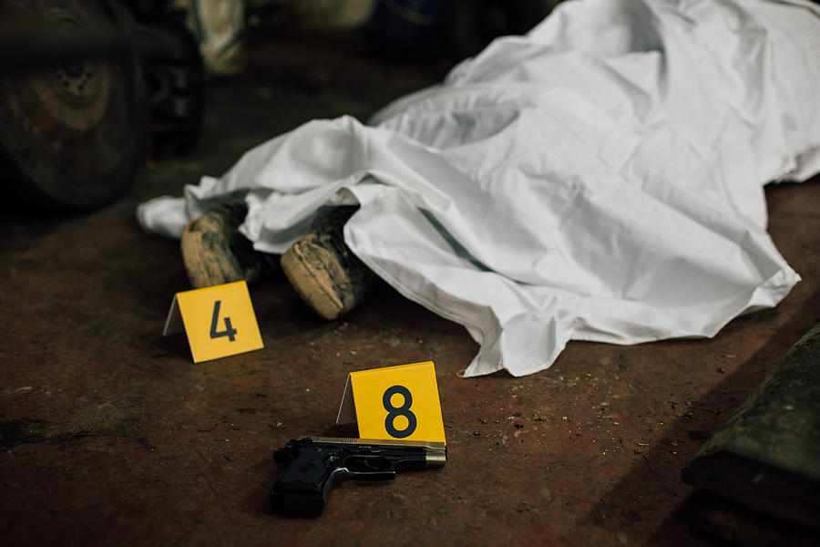 Crime scene investigation - covered human body and evidences Photograph by FlyMint Agency