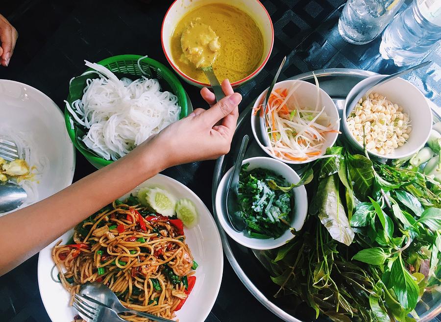 Cropped Hand Having Food At Table Photograph by Netthip Kobkeattawin / EyeEm Cropped Hand Having Food At Table Photograph by Netthip Kobkeattawin / EyeEm