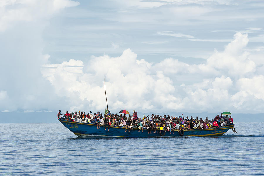 Crowded refugee boat on Lake Tanganyika Photograph by Guenterguni