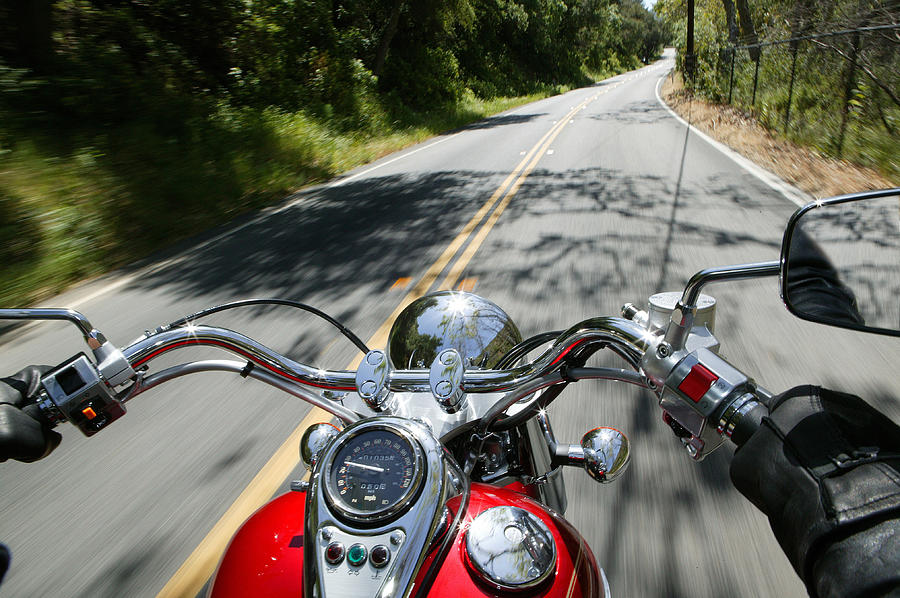 Cruiser motorcycle on a open road Photograph by Hirkophoto