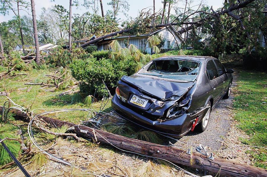 Car Photograph - Crushed Car After Hurricane Katrina by David Hay Jones/science Photo Library