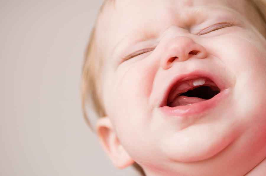Crying Baby Suffering Through Pain of Teething Photograph by Ideabug