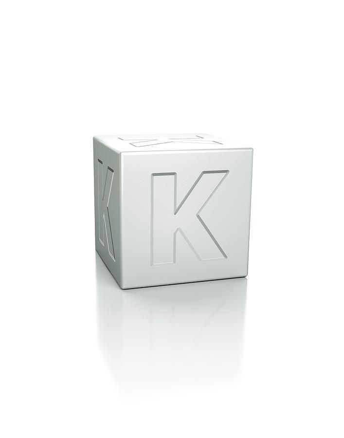 Cube Photograph - Cube With The Letter K Embossed by David Parker/science Photo Library