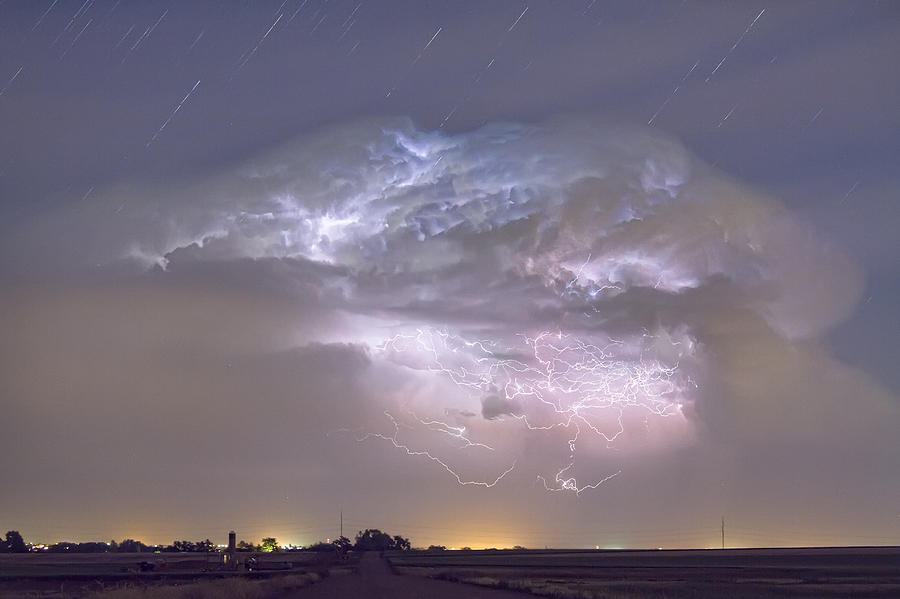Cumulo-nimbus Lightning Storm and Star Trails Above Photograph by James BO Insogna