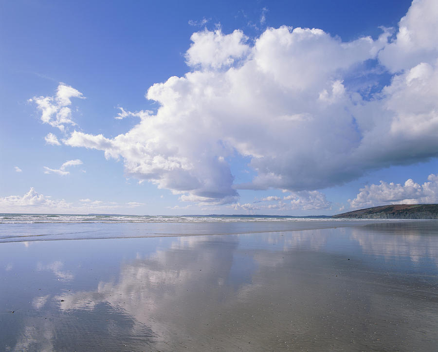 Cumulus Clouds Reflected On Water Photograph by Simon Fraser/science Photo Library